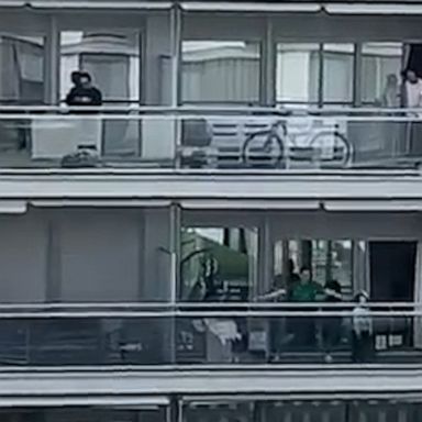 VIDEO: Quarantined residents in Spain take to their balconies for group exercise