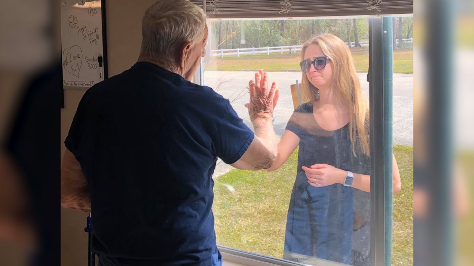 VIDEO: Woman surprises quarantined grandpa with engagement news through nursing home window