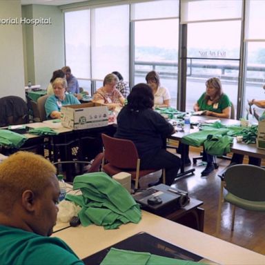 VIDEO: Volunteers stitch masks together for health care workers