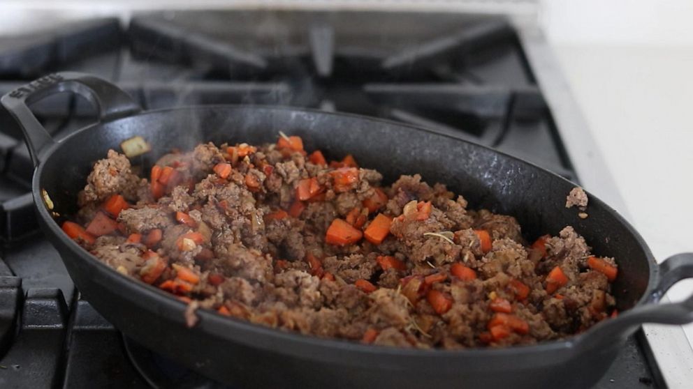 PHOTO: Ground beef filling for shepherd's pie sautéed in a cast iron pan.
