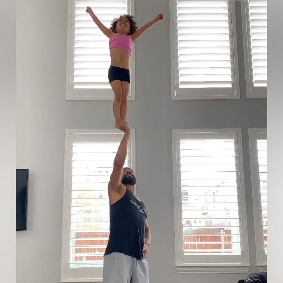 Video This Dad Daughter Cheerleading Stunt Duo Are Some Serious Squad Goals Abc News