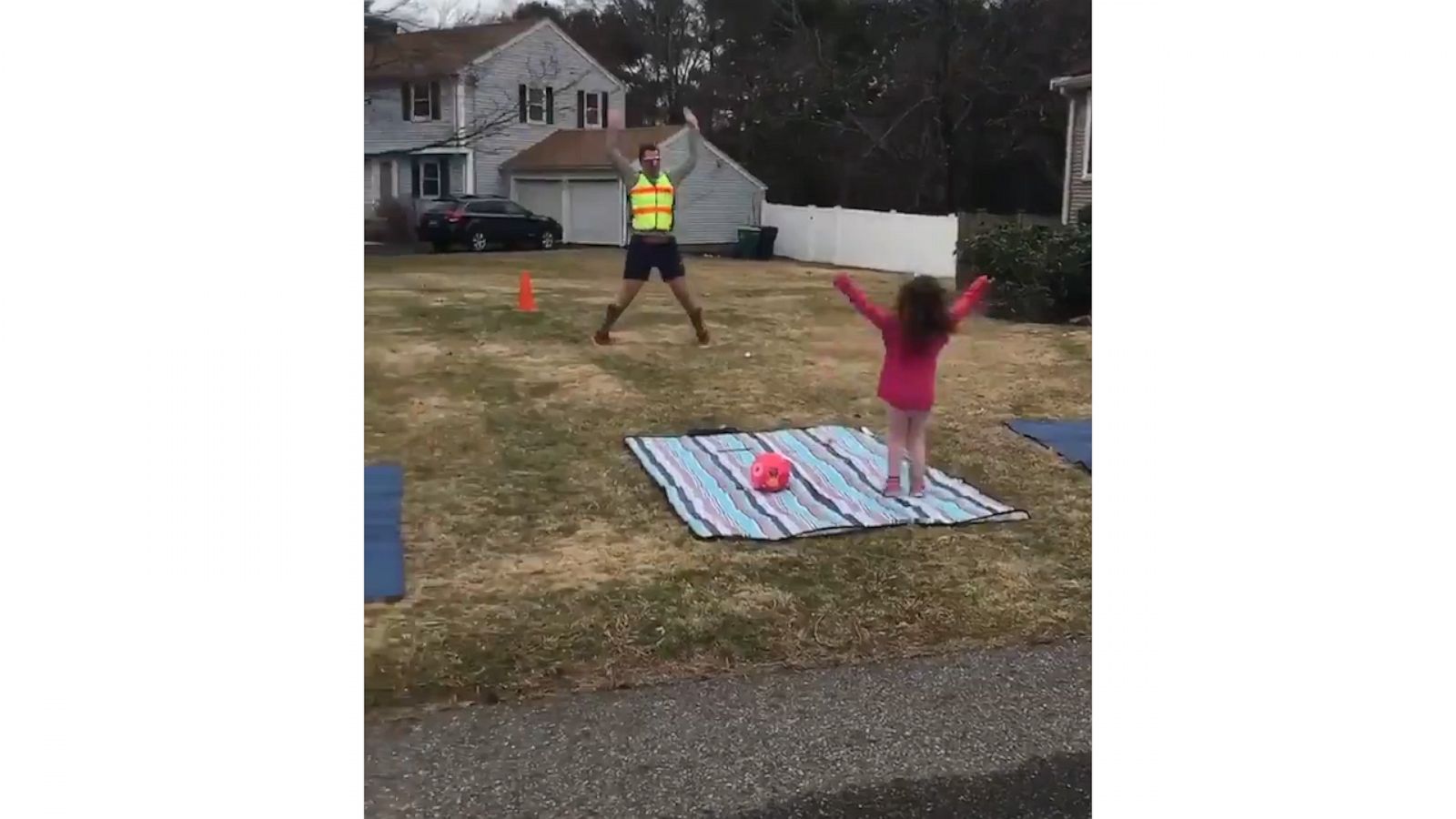 VIDEO: #GirlDad gets his daughters to do home PE 'crossing guard' style