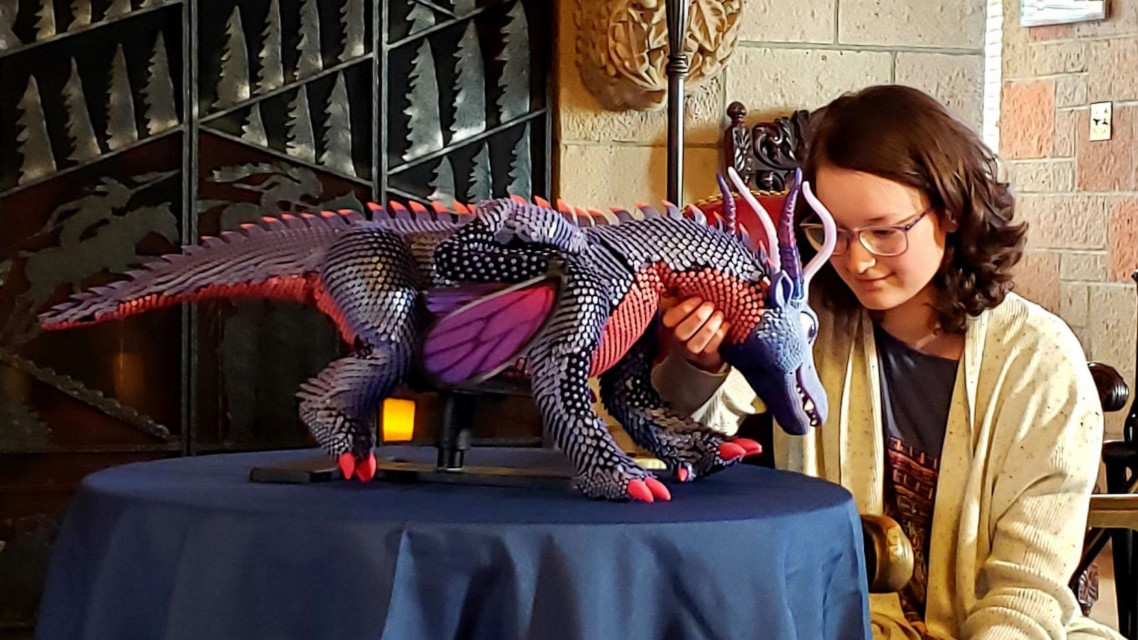 PHOTO: Belle Cress, 14, meets her specially-designed pet dragon.