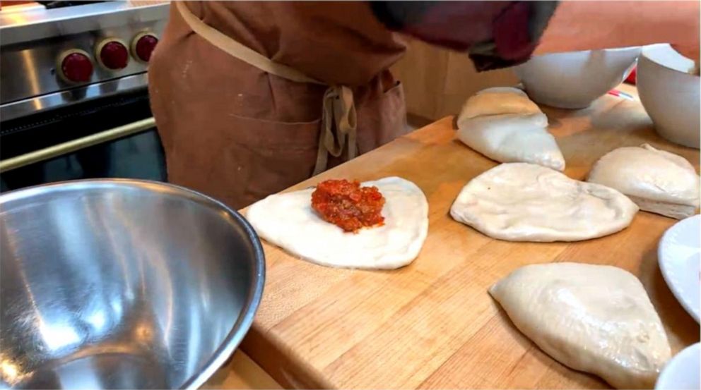 PHOTO: Chef Michael Symon makes his pizza bites in his home kitchen on "GMA."