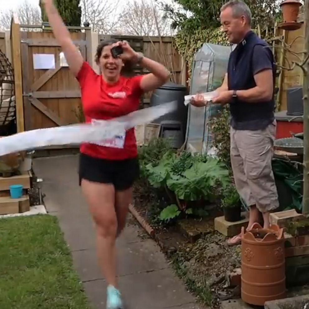VIDEO: This woman ran a marathon in her backyard to raise money for COVID-19 workers 
