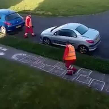 VIDEO: Sanitation workers take a moment to put their hopscotch skills to the test