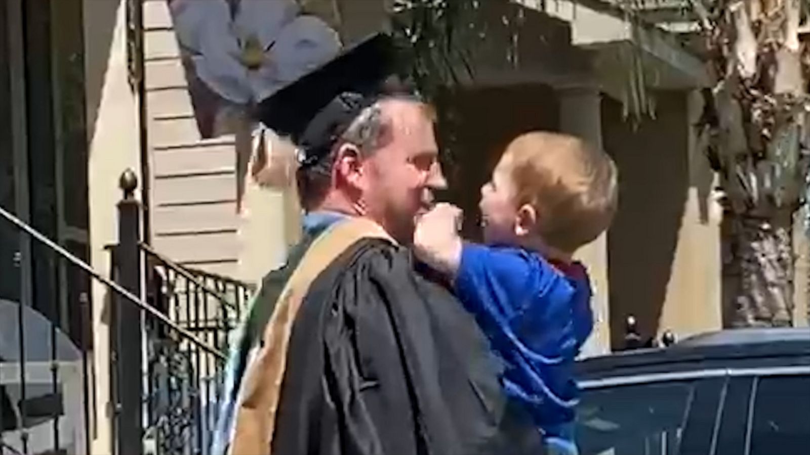 VIDEO: 3-year-old gives dad his 'diploma' in front yard graduation celebration