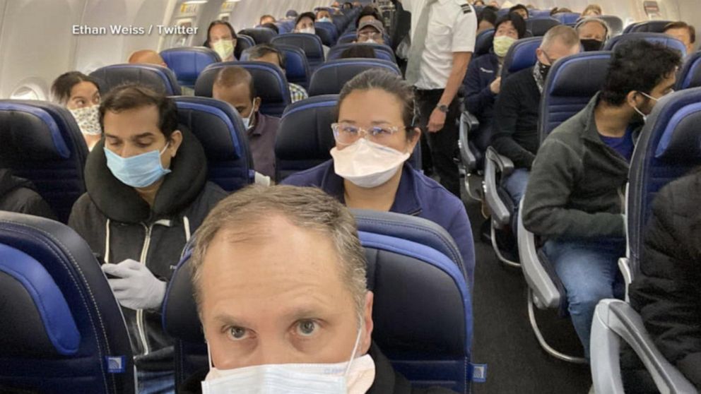 Doctor speaks out after viral photo of packed plane