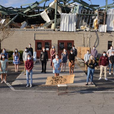 VIDEO: First a pandemic, then a tornado: Seniors pose by destroyed school 