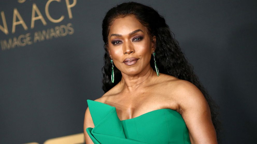 angela bassett green dress Video Our favorite moments for her birthday feather dresses