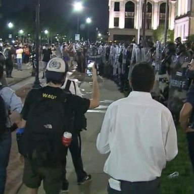 VIDEO: Demonstrators face off with police after officer-involved shooting