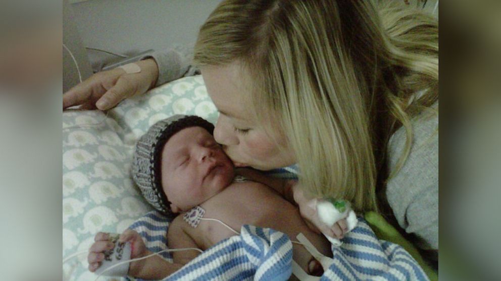 Sarah Hammitt, gives her son, Bowen a kiss. 