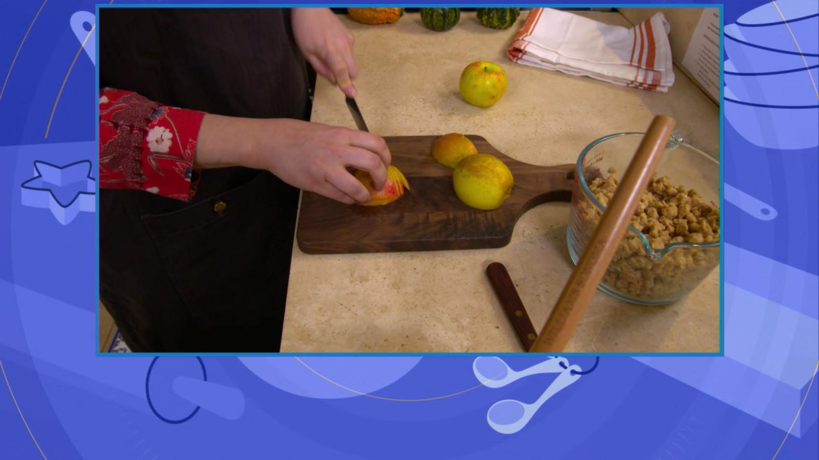 PHOTO: Claire Saffitz shows how to slice an apple using the tip of her knife so it doesn't stick while cutting.