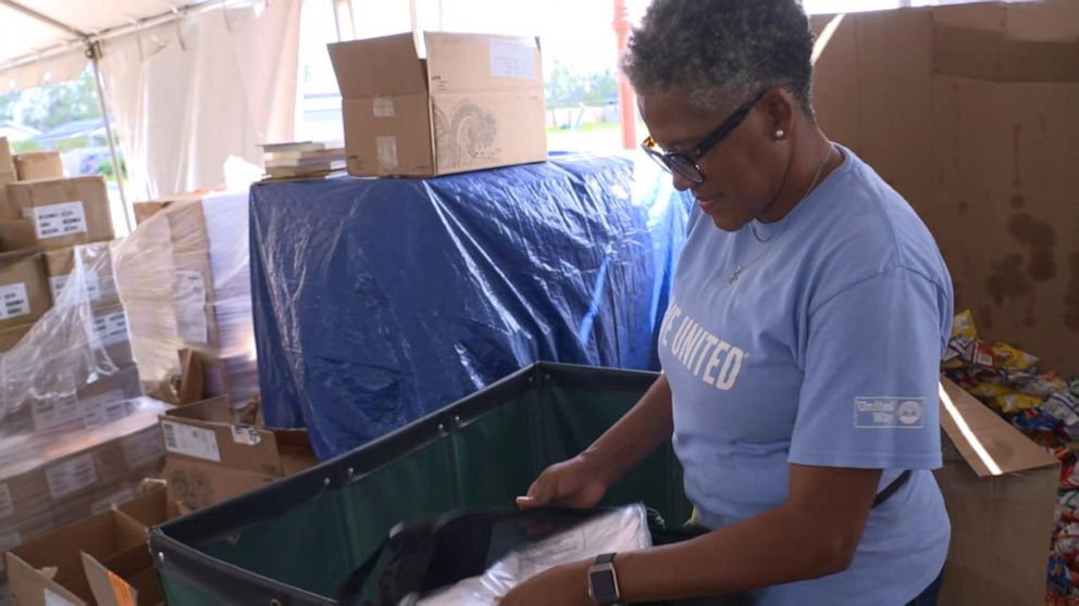 PHOTO: A volunteer helps prepare items for residents in need after the hurricanes in Louisiana.
