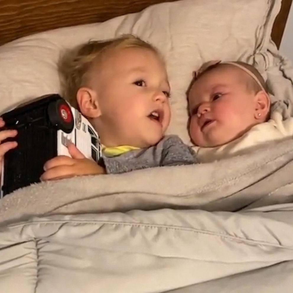 VIDEO: Toddler adorably calms baby sister in viral video