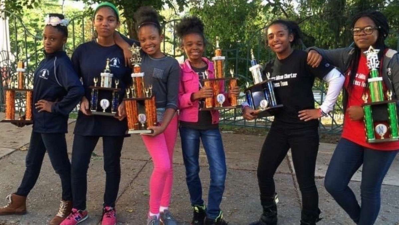 PHOTO: Principal El instills confidence in his young female students through the game of chess.