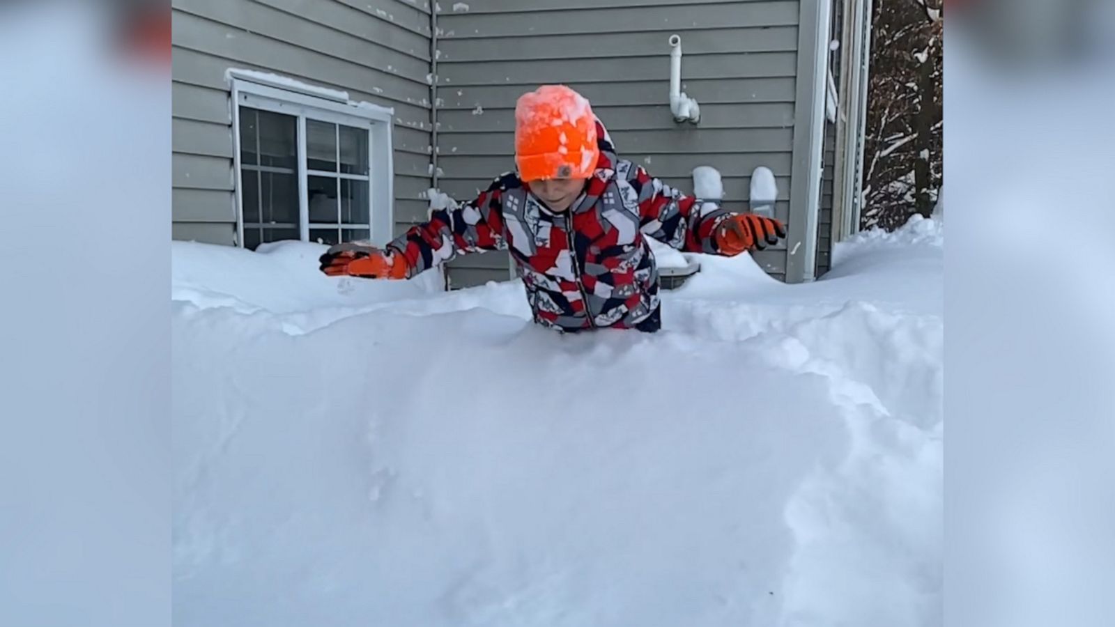VIDEO: Boy dives into snow and disappears after winter storm