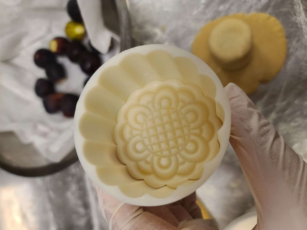 PHOTO: Pastry chef Clarice Lam holds a mooncake mold used for her specialty treats at Kimika.