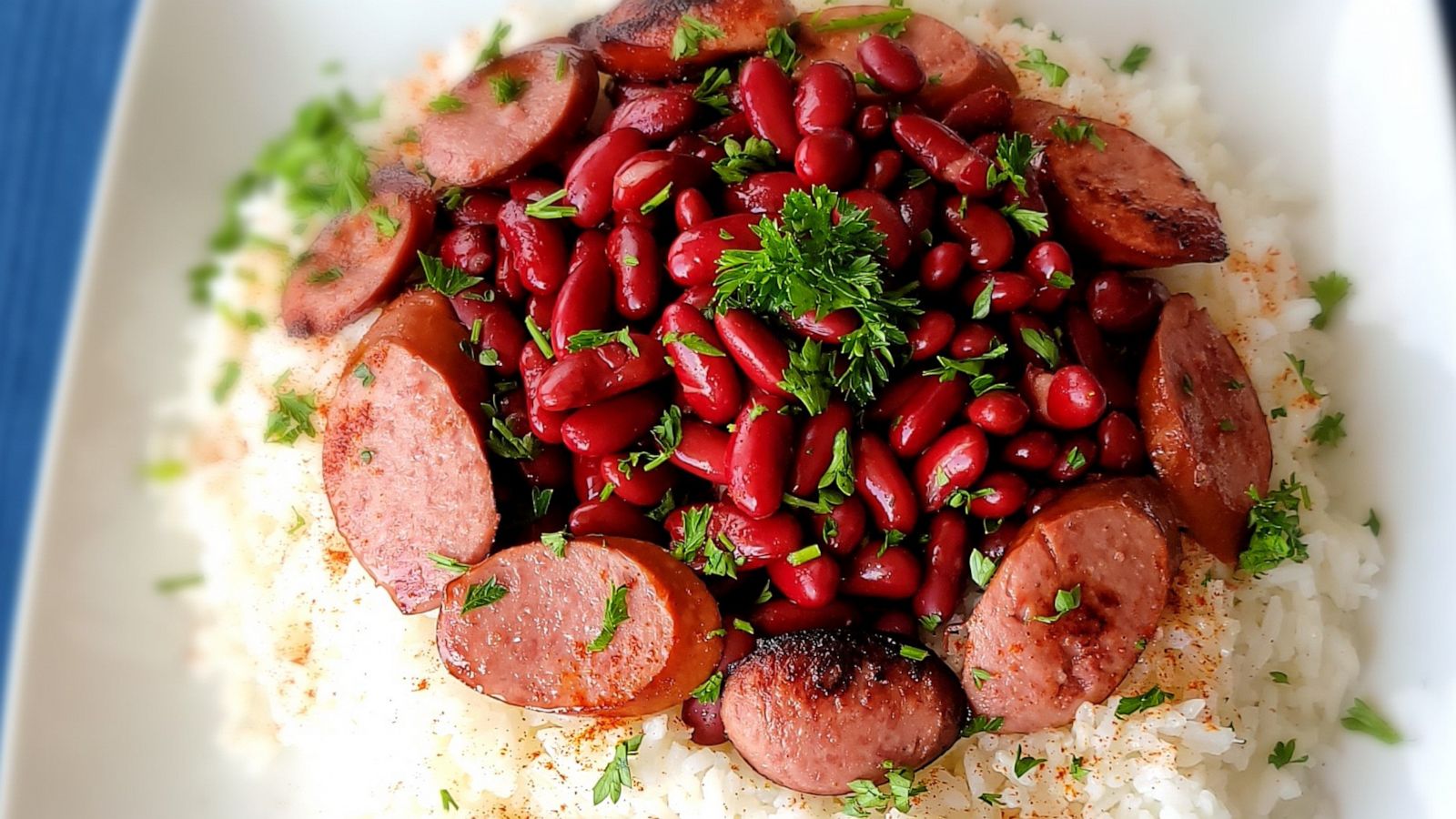 PHOTO: A plate of red beans and rice with sausage.