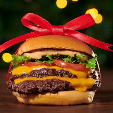 PHOTO: A Double ShackBurger from Shake Shack with a red holiday bow.