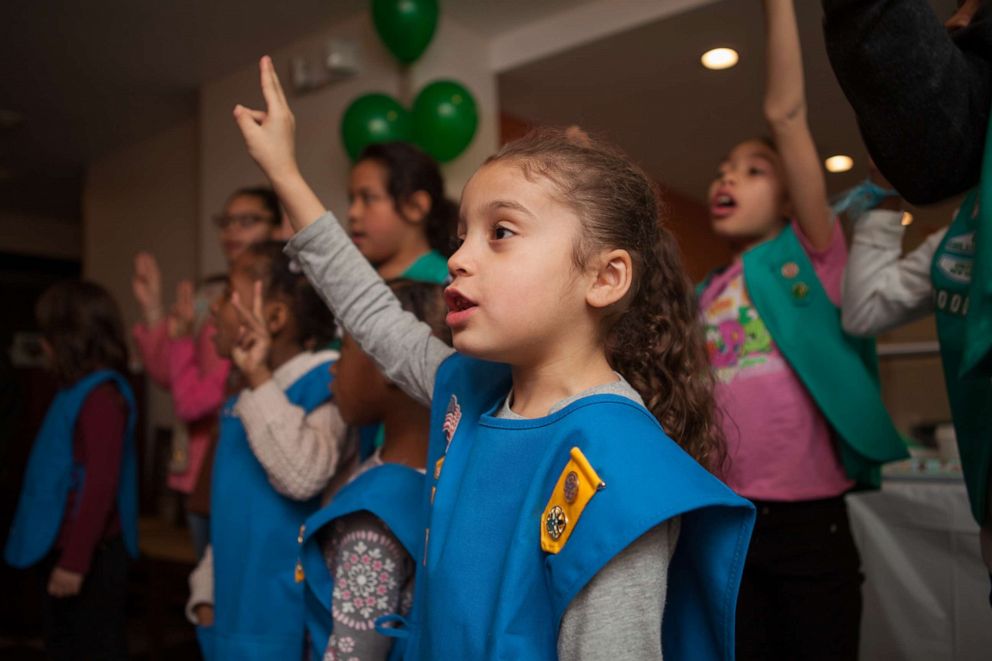 Buy cookies from this troop of Girl Scouts in the New York City shelter