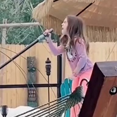 VIDEO: Dad secretly films 8-year-old as she belts ‘Girl on Fire’ while cleaning the pool