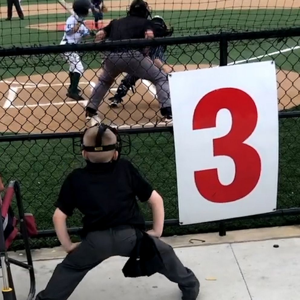 Video Boy imitates umpire at baseball game and steals the show