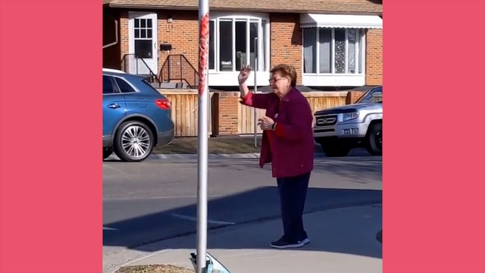 VIDEO Adorable 84-year-old woman gives air hugs, waves and blows kisses at street corner