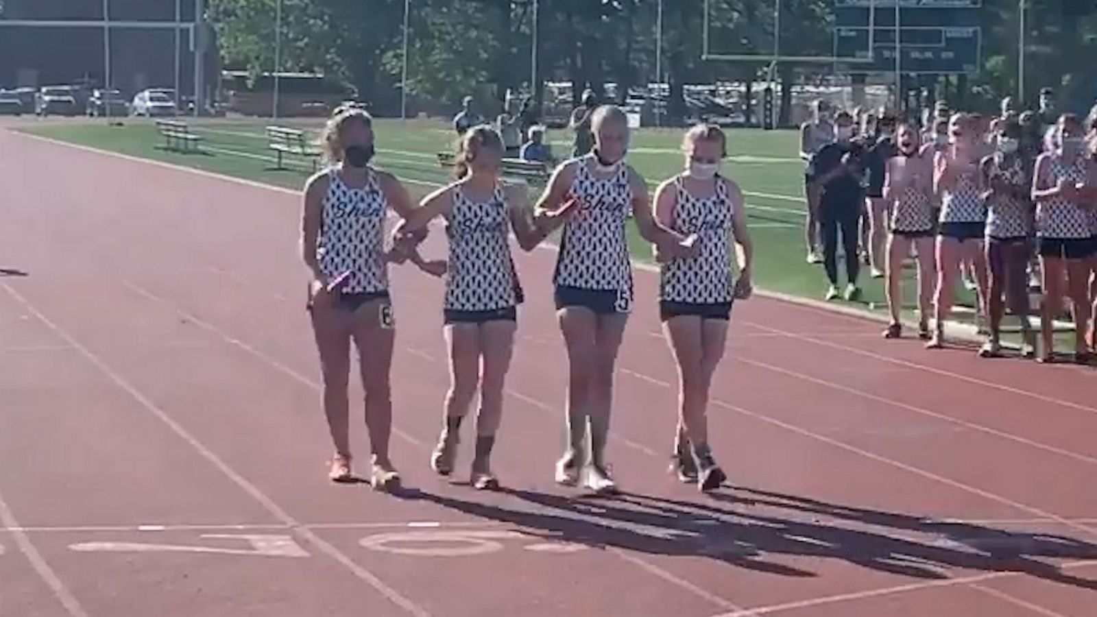 VIDEO: High school runner with cancer crosses finish line with her team at her side