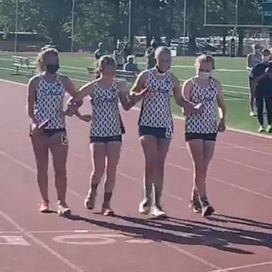 VIDEO: High school runner with cancer crosses finish line with her team at her side 