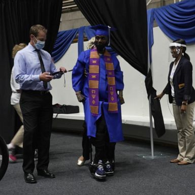 VIDEO: Paralyzed football player walks across stage to get diploma