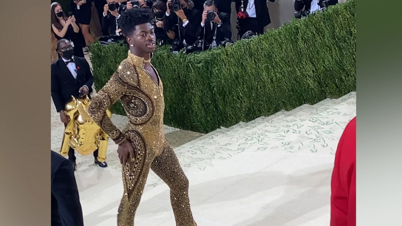 Watch Lil Nas X transform into his gold bodysuit at the MET Gala Good