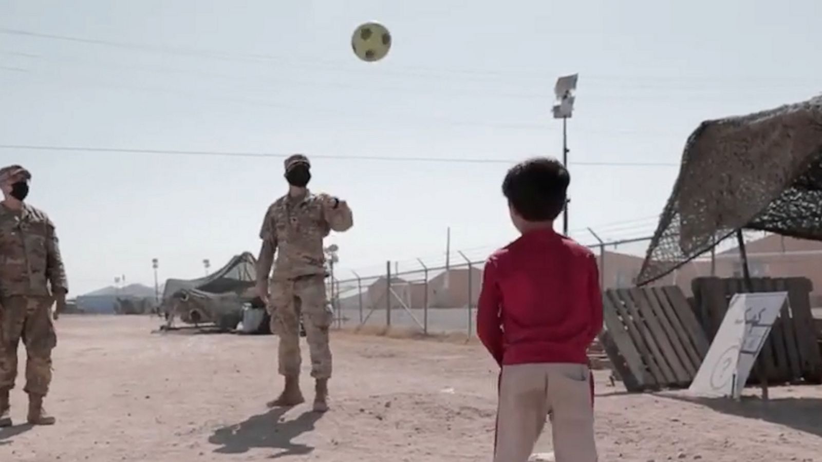 VIDEO: Evacuated Afghan children play soccer with U.S. soldiers