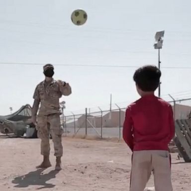 VIDEO: Evacuated Afghan children play soccer with U.S. soldiers