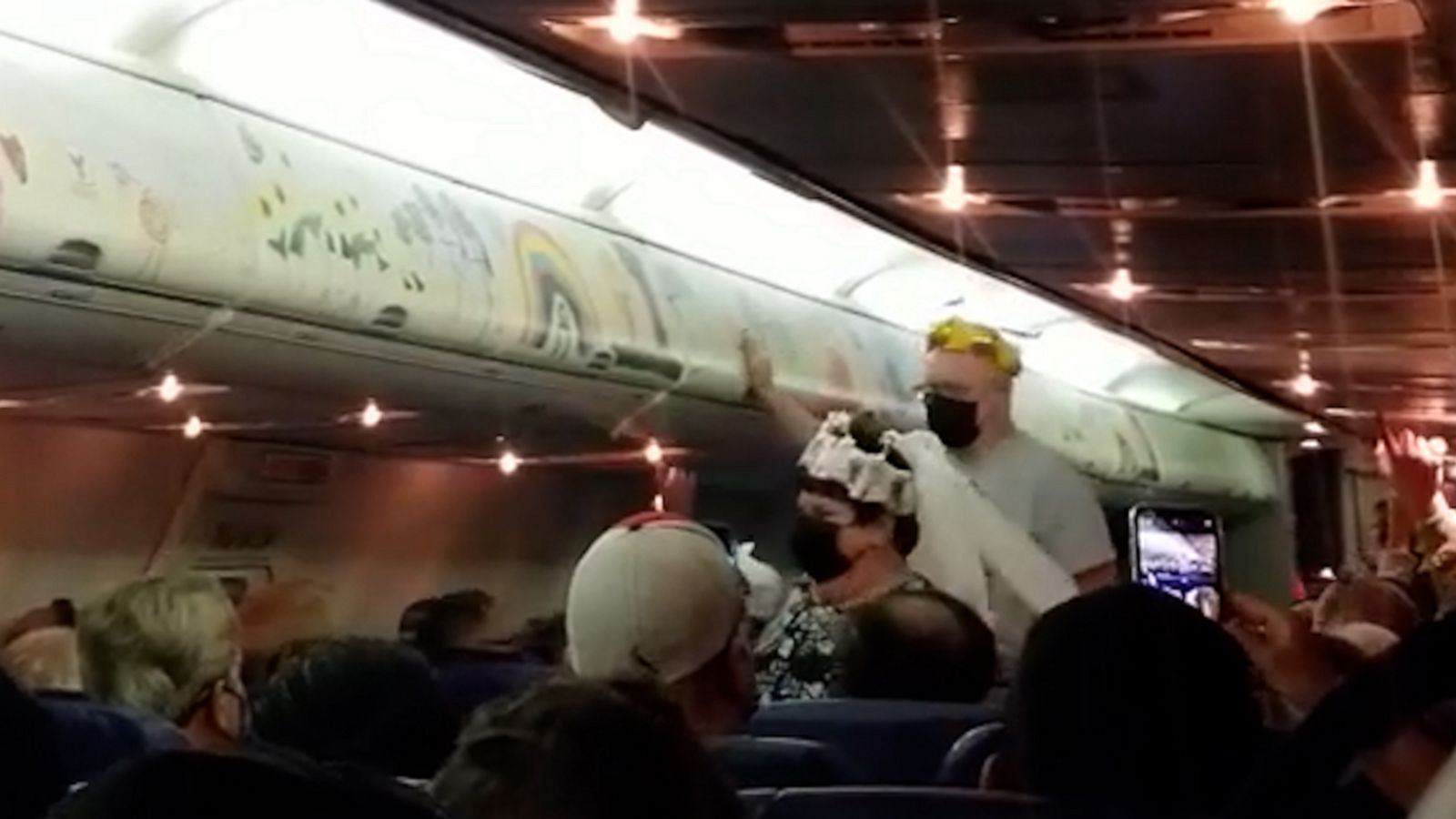 VIDEO: Newlywed couple walks down airplane aisle after getting hitched in Vegas