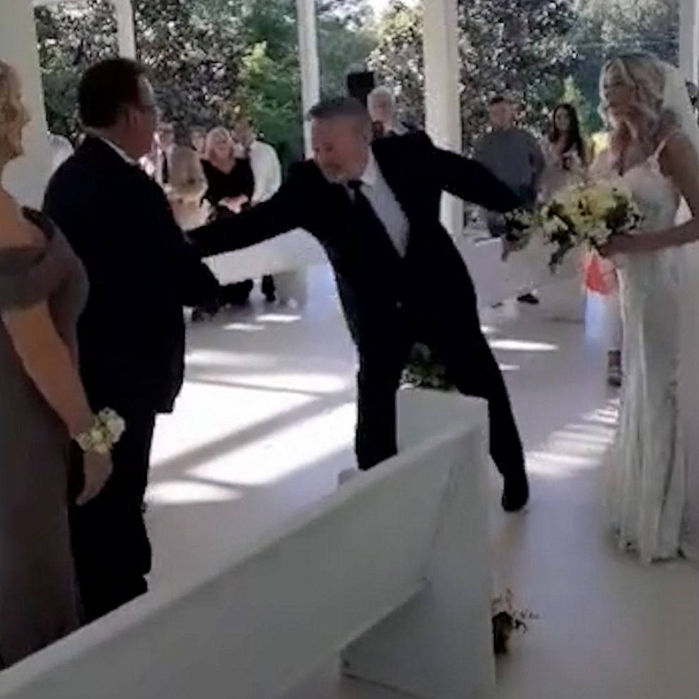 Dad surprises stepdad by asking him to join in walking the bride down the  aisle