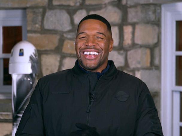 Michael Strahan gets hooked up to a machine that simulates labor