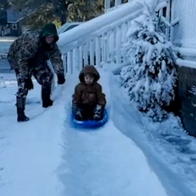 VIDEO: Dad uses snowmaking machine to make epic sledding ramp for his kids 