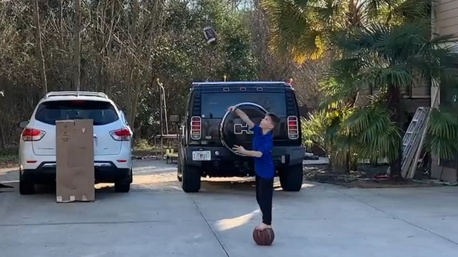 VIDEO: Inspired by the Super Bowl, eight-year-old shoots hoops using a football