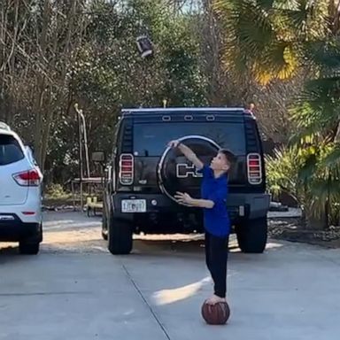 VIDEO: Inspired by the Super Bowl, eight-year-old shoots hoops using a football