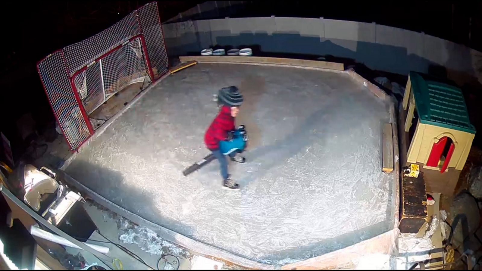 VIDEO: 8-year-old boy hops on a leaf blower to zoom across his backyard hockey rink