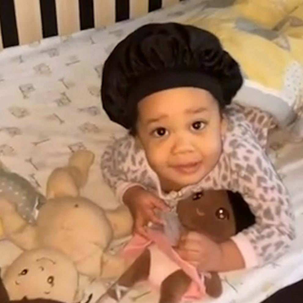 VIDEO: Watch the adorable journey of a 2-year-old learning to love wearing her bonnet to bed