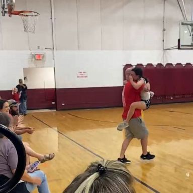 VIDEO: Dad and daughter share emotional hug after she made her first basket 