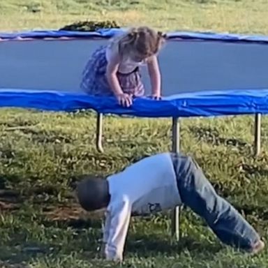 VIDEO: Brother adorably helps sister off trampoline