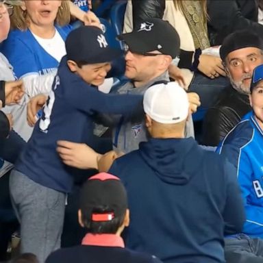 VIDEO: Baseball fan gives home run ball to young boy