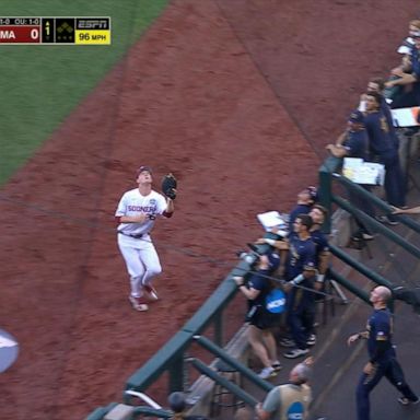 VIDEO: College baseball player takes tumble while catching ball