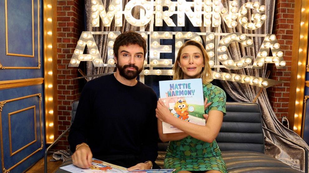 Elizabeth Olsen and Robbie Arnett read their new children's book