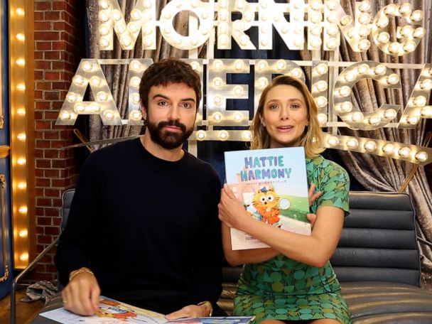 Elizabeth Olsen and Robbie Arnett read their new children's book