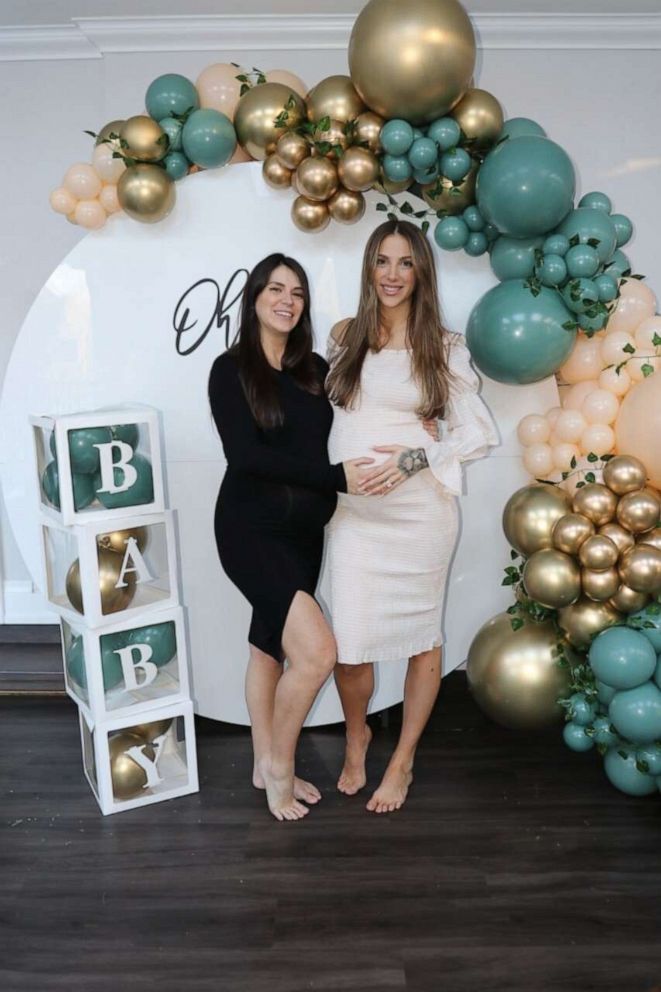 PHOTO: Samantha (left) and Danielle (right) Schleese pose at their baby shower.
