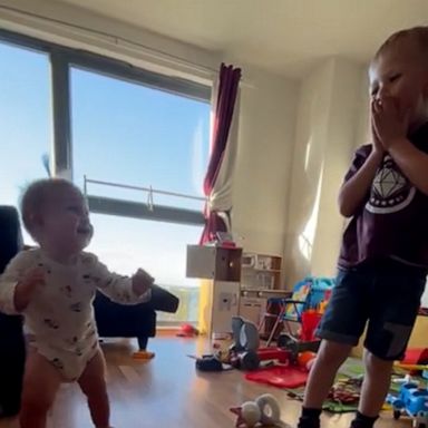 VIDEO: Little boy has the best reaction to seeing baby sister take her first steps